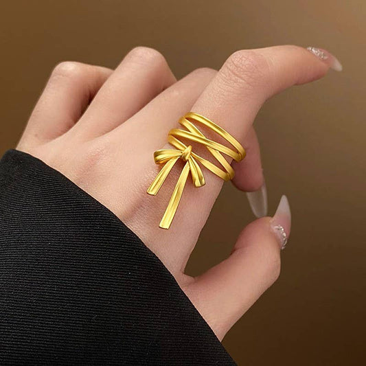 ADJUSTABLE BOLD BOW RING